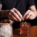 Alley Bar bartender David Martinez adds mint leaves to a "Top O' The Morning to Ya" drink on Tuesday, June 18. Daniel Brenner I AnnArbor.com