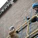 Foreman Shaun Michaels and Laborer Zach Dillinger organize extension cords on top of a scissor lift before removing the Borders sign on Liberty Street on Monday Dec. 31. Daniel Brenner I AnnArbor.com