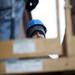 Foreman Shaun Michaels operates a scissor lift on Liberty Street on Monday Dec. 31. Daniel Brenner I AnnArbor.com