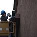 Foreman Shaun Michaels detaches the Borders sign from the brick wall on Monday Dec. 31. Daniel Brenner I AnnArbor.com