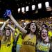 Michigan sophomores Yasmin Omrani and Siobhan Aldridge cheer during a promotional video before the game against Louisville on Monday, April 8. Daniel Brenner I AnnArbor.com