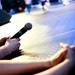 A Dance Marathon at the University of Michigan participant holds a microphone near stage on Sunday, April 7. Daniel Brenner I AnnArbor.com