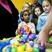 Burns Park resident Maia Rivette, seven, dumps out collected eggs at the Easter Egg Hunt and Breakfast at Ann Arbor Vineyard Church on Saturday, March 30. Daniel Brenner I AnnArbor.com