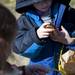 Livonia resident, six, collects and sorts eggs after participating Jaycees Easter Egg Scramble in Buhr Park on Saturday, March 30. This was his first time attending the  event. Daniel Brenner I AnnArbor.com