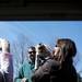 A White-faced capuchin named Seymore climbs on people at the Jaycees Easter Egg Scramble on Saturday, March 30. Daniel Brenner I AnnArbor.com