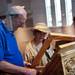 Chairman of tour guides Mike Kapetan and Ann Arbor resident Zora Singer inspect and discuss an icon inside the St. Nicholas Greek Orthodox Church during the Ya'ssoo Greek Festival on Friday, May 31. Daniel Brenner I AnnArbor.com
