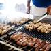 Nick Stamadianos rotates chicken kebabs on the grill during the Ya'ssoo Greek Festival on Friday, May 31. Daniel Brenner I AnnArbor.com