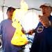 Auraam Piniatogia and Costas Boutsikakis ignite flaming cheese during the Ya'ssoo Greek Festival on Friday, May 31. Daniel Brenner I AnnArbor.com