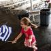Maria Eva Foerster runs with a Greek flag during the Ya'ssoo Greek Festival on Friday, May 31. Daniel Brenner I AnnArbor.com