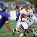 Warren De La Salle Defensive Back Josh Cox starts running after catching an interception Friday night.  De La Salle won 35-7. Daniel Brenner I AnnArbor.com