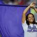A Pioneer flag girl smiles during the half time performance Friday. Daniel Brenner I AnnArbor.com
