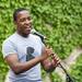 Ann Arbor resident and Lord Byron Security Team band member Thabiso Mhlaba sings during the Live on Washington Music and Arts Festival on Saturday, June 1. Daniel Brenner I AnnArbor.com