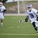 Pioneer junior Niko Michos runs up the field with the ball in the game against Skyline on Friday, April 12. AnnArbor.com I Daniel Brenner