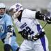 Pioneer junior Erik Barroso attempts to get pass Skyline player Ethan Hiltner on Friday, April 12. AnnArbor.com I Daniel Brenner