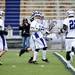 Pioneer senior Ryan Huffnagle celebrates a score with teammates in the game against Skyline on Friday, April 12. AnnArbor.com I Daniel Brenner