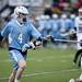 Skyline Jack Fisher looks to get around a Pioneer defender on Friday, April 12. AnnArbor.com I Daniel Brenner