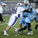 Pioneer senior Ryan Huffnagle hits a Skyline player on Friday, April 12. AnnArbor.com I Daniel Brenner