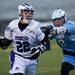 Skyline Ethan Hiltner hits Pioneer junior Erik Barroso on Friday, April 12. AnnArbor.com I Daniel Brenner