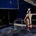 Arizona resident Tamara Castillo stretches on the concourse level of Crisler Arena during Dance for Mother Earth Powwow on Saturday, April 6. Daniel Brenner I AnnArbor.com