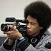 New Tech High School junior Isaiah Mahler documents a portion of the Willow Run Airport tour and update in Ypsilanti on Tuesday, March 26. Daniel Brenner I AnnArbor.com
