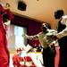 Friends and family embrace valedictorian Charles Acquah after speaking during Willow Run Graduation on Friday, May 31. Daniel Brenner I AnnArbor.com