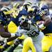 Michigan running back Fitzgerald Toussaint runs the ball during the first quarter of the game against Northwestern on Saturday. The game is tied 14-14. Daniel Brenner I AnnArbor.com