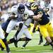 Northwestern running back Venric Mark is tackled by Michigan defense on Saturday. Daniel Brenner I AnnArbor.com