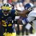 Michigan wide receiver Roy Roundtree avoids being tackled and gains yard in overtime of the game against Northwestern on Saturday. Daniel Brenner I AnnArbor.com