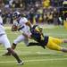 Michigan linebacker Jake Ryan tackles Northwestern quarterback Kain Colter in overtime on Saturday. Daniel Brenner I AnnArbor.com