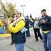 Season ticket holder Barb Jandasek cheers as the Michigan football team buses drive by on Saturday. Jandasek is a UM alumni. Daniel Brenner I AnnArbor.com