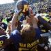 MIchigan players celebrate with the brown jug as Michigan took on the University of Minnesota Saturday October 1, 2011. Michigan won the game 58-0 Jeff Sainlar I AnnArbor.com 
