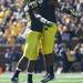 Michigan's Blake Countess(left) celebrates with J.T. Floyd as Michigan took on the University of Minnesota Saturday October 1, 2011. Michigan won the game 58-0 Jeff Sainlar I AnnArbor.com 
