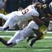 Stephen Hopkins is gang tackled as Michigan took on the University of Minnesota Saturday October 1, 2011. Michigan won the game 58-0 Jeff Sainlar I AnnArbor.com 
