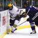 Michigan's Derek DeBlois battles over control of the puck with Matt Williams as Michigan took on Niagara University in their season opener at Yost Ice Arena Tuesday October, 4, 2011. Michigan won the match 5-0. Jeff Sainlar I AnnArbor.com