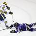 Michigan's David Wohlberg fires a shot while Matt Williams attempts to block it as Michigan took on Niagara University in their season opener at Yost Ice Arena Tuesday October, 4, 2011. Michigan won the match 5-0. Jeff Sainlar I AnnArbor.com