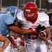 Bedford's Aaron Czesak tries to break through a tackle as the Skyline Eagles took on the Bedford Mules at Skyline High School Thursday October 6, 2011. Berford won the game 23-20. Jeff Sainlar I AnnArbor.com