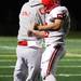 Bedford's Josh Thoma celebrates with a coach as the Skyline Eagles took on the Bedford Mules at Skyline High School Thursday October 6, 2011. Bedford won the game 23-20. Jeff Sainlar I AnnArbor.com