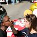 Shelby Hepner (right) shows off her face painting skills at the "Meet on the Street Community Block Party," out in front of Grace Fellowship Church in Ypsilanti  Saturday October 8, 2011. Pastor Willie J. Powell of Grace Fellowship Church along with Pastor Julianne Smeck of St. Mark Lutheran Church decided to put this on together to connect the communities. Jeff Sainlar I AnnArbor.com