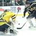 Michigan's goalie Shawn Hunwick stops a Brett Hartung shot as the Michigan Wolverines took on the Bentley Falcons at Yost Ice Arena Saturday October 8, 2011. Michigan won the match 4-1. Jeff Sainlar I AnnArbor.com