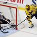 Michigan's Chris Brown tries to sneak a shot in as the Michigan Wolverines took on the Bentley Falcons at Yost Ice Arena Saturday October 8, 2011. Michigan won the match 4-1. Jeff Sainlar I AnnArbor.com