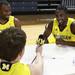 Evan Smotrycz takes a stab at interviewing fellow teammates, Eso Akunne(left) and Corey Person at the University of Michigan's men and women's media day Tuesday October 11, 2011. Jeff Sainlar I AnnArbor.com