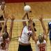  Britton Deerfield's McKayla Herriman spikes it on Kelly O'Neil(8) and Maddie Carpenter as Whitmore Lake took on Britton Deerfield at Whitmore High School. Whitmore won the best of five series 3-0. Tuesday October 11, 2011. Jeff Sainlar I AnnArbor.com