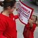 Madeline Hendriksma,6, comes out to show her enthusiasm of the protest with mother, Amy. Over 400 nurses and supporters showed up to take part in the rally at Liberty Plaza downtown to march to the University of Michigan Hospital and protest Wednesday October, 12, 2011. Jeff Sainlar I AnnArbor.com