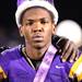 Senior quarterback Daryl Tipton takes a break from playing football to accept his homecoming king crown as Ypsilanti took on Lincoln High School at Ypsilanti High School Friday October 14, 2011.  Lincoln won the game 27-12 to advance to their first ever playoff berth.  Jeff Sainlar I AnnArbor.com
