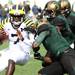 Michigan's Devin Gardner is taken down by three Sparten defenders as Michigan took on Michigan State Saturday October 15, 2011 at Spartan Stadium. Michigan State won the game 28-14.  Jeff Sainlar I AnnArbor.com