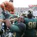 Jairus Jones celebrates with the Paul Bunyan Trophy as Michigan took on Michigan State Saturday October 15, 2011 at Spartan Stadium. Michigan State won the game 28-14.  Jeff Sainlar I AnnArbor.com