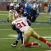 Brandon Pettigrew is tackled by Donte Whitner as the Detroit Lions took on the San Francisco 49ers Sunday October 16, 2011 at Ford Field. San Francisco  won the game 25-19.  Jeff Sainlar I AnnArbor.com