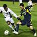 Akron's DeAndre Yedlin (left) and David Yang battle for the ball as the Michigan Wolverines took on the Akron Zips Tuesday, Oct. 18, 2011 at the Michigan Soccer Complex. Michigan defeated the No. 4 Zips, 1-0, in overtime.  Jeff Sainlar I AnnArbor.com