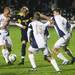 Michigan's Matthew Rickard is harassed by Akron defenders as the Michigan Wolverines took on the Akron Zips Tuesday, Oct. 18, 2011 at the Michigan Soccer Complex. Michigan defeated the No. 4 Zips, 1-0, in overtime.  Jeff Sainlar I AnnArbor.com