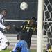 Michigan's Kofi Opare (6) heads the ball away from the goal as the Michigan Wolverines took on the Akron Zips Tuesday, Oct. 18, 2011 at the Michigan Soccer Complex. Michigan defeated the No. 4 Zips, 1-0, in overtime.  Jeff Sainlar I AnnArbor.com